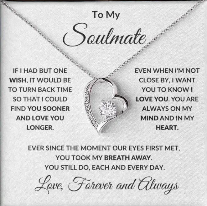 Heart-shaped necklace with sentimental message on a card